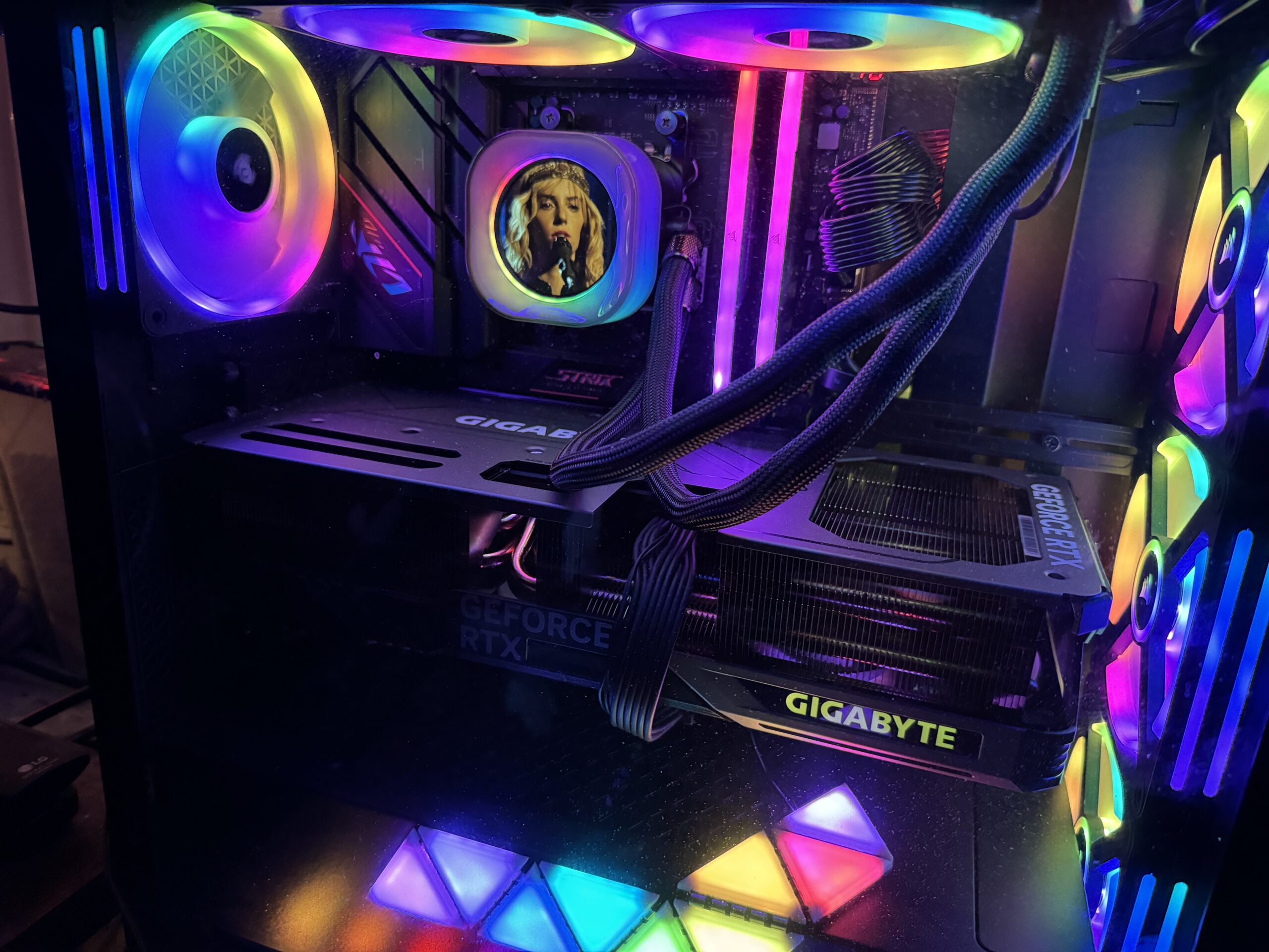The interior of a gaming PC showing components and RGB lighting.